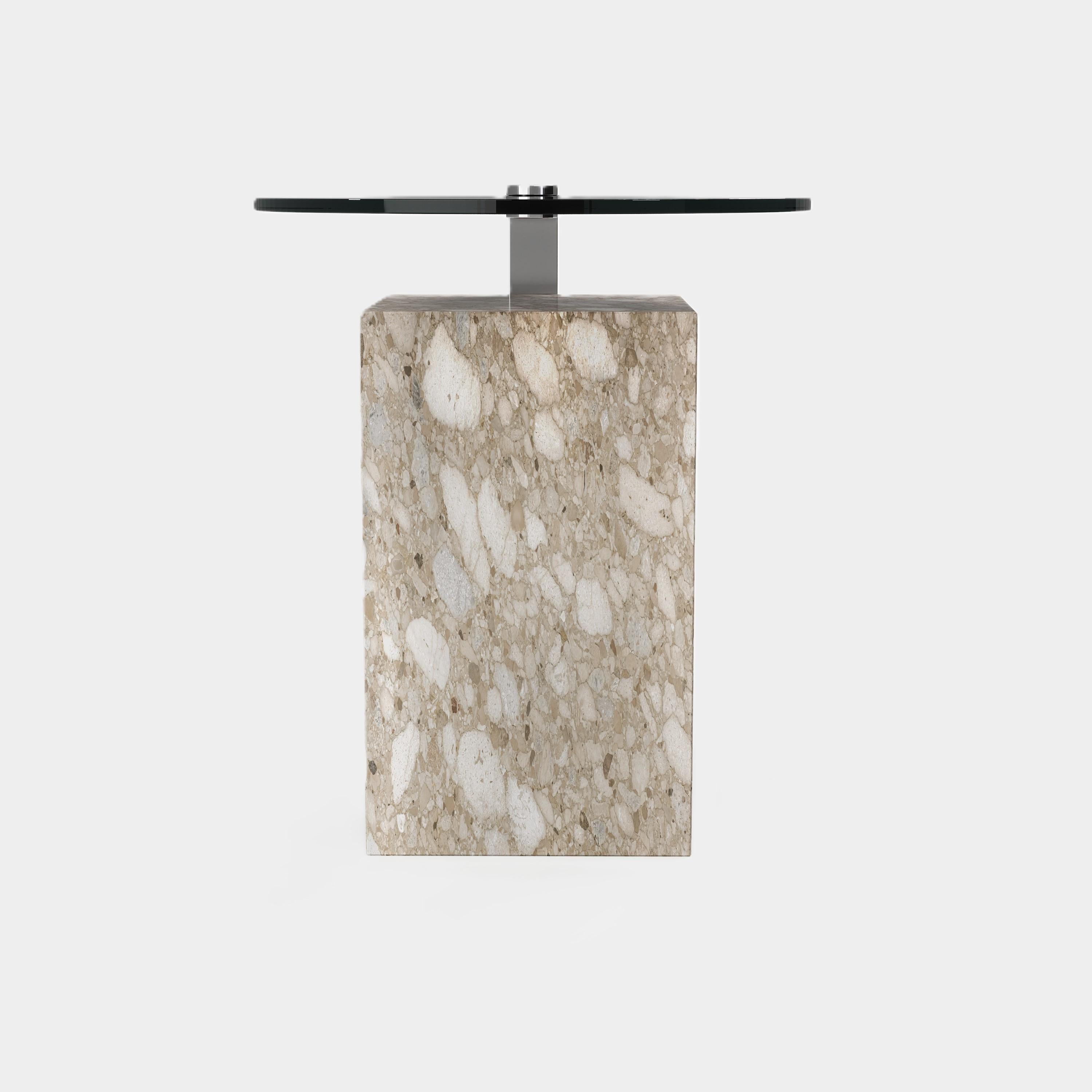 This statement-making side table features a rectangular marble base with unique natural veining, topped with a sleek metal surface. Its modern silhouette and contrasting materials create a striking focal point for your living area.

This design is