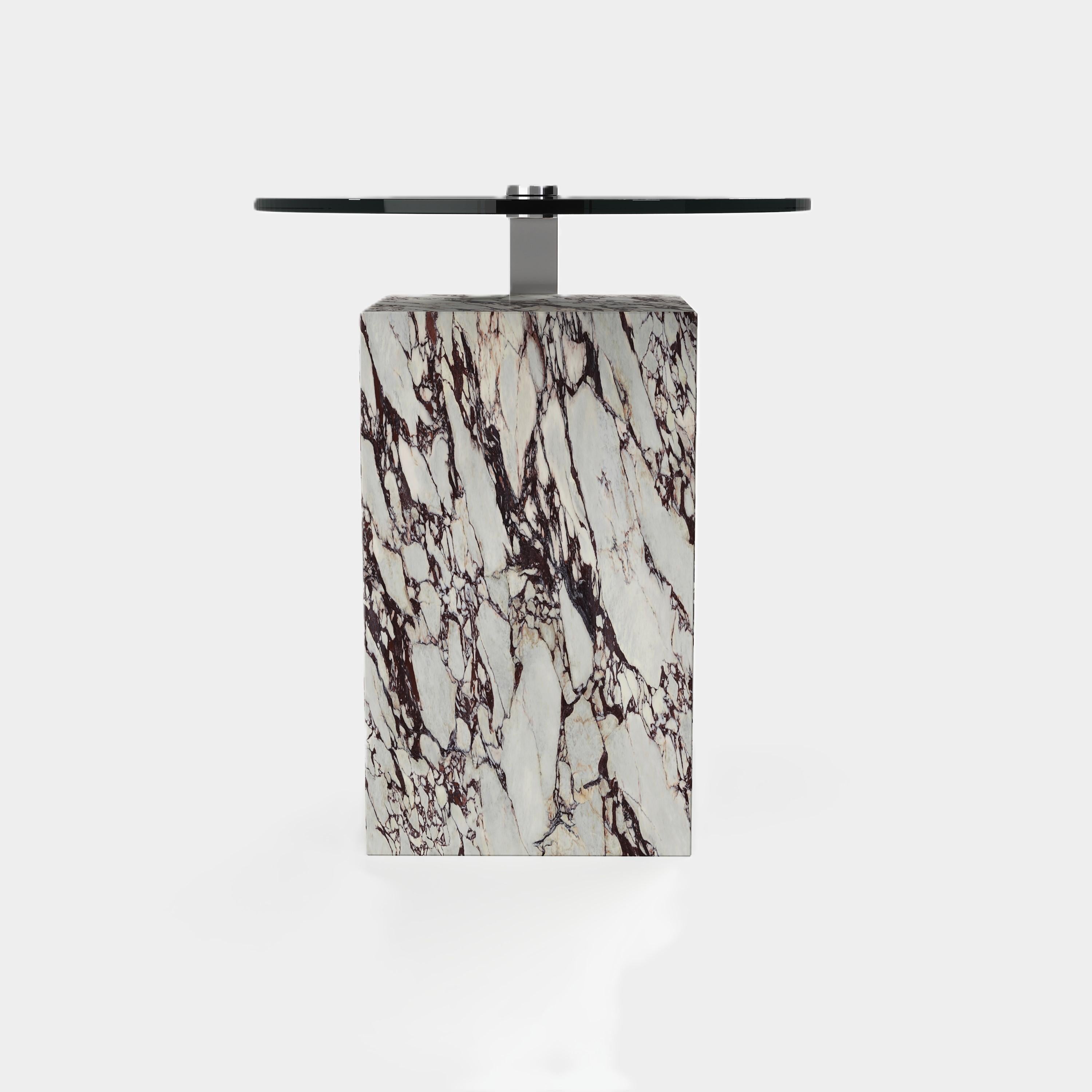 This statement-making side table features a rectangular marble base with unique natural veining, topped with a sleek metal surface. Its modern silhouette and contrasting materials create a striking focal point for your living area.

This design is