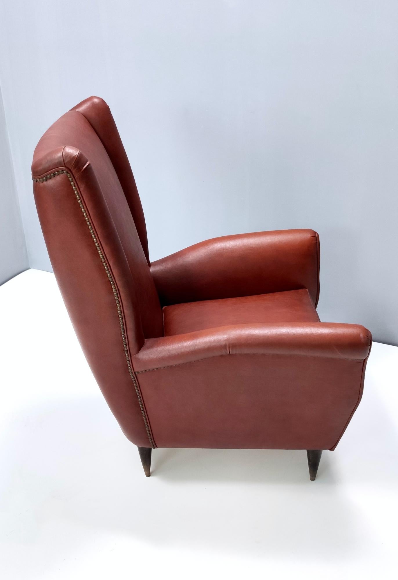 Faux Leather Skai Wingback Armchair Ascribable to Mod. 512 attr. to Gio Ponti Produced by ISA For Sale