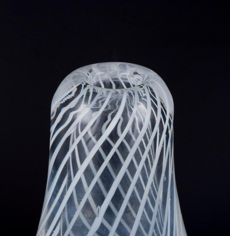 Scandinavian Skandinavian glass artist. Art glass vase in clear glass with white lines For Sale