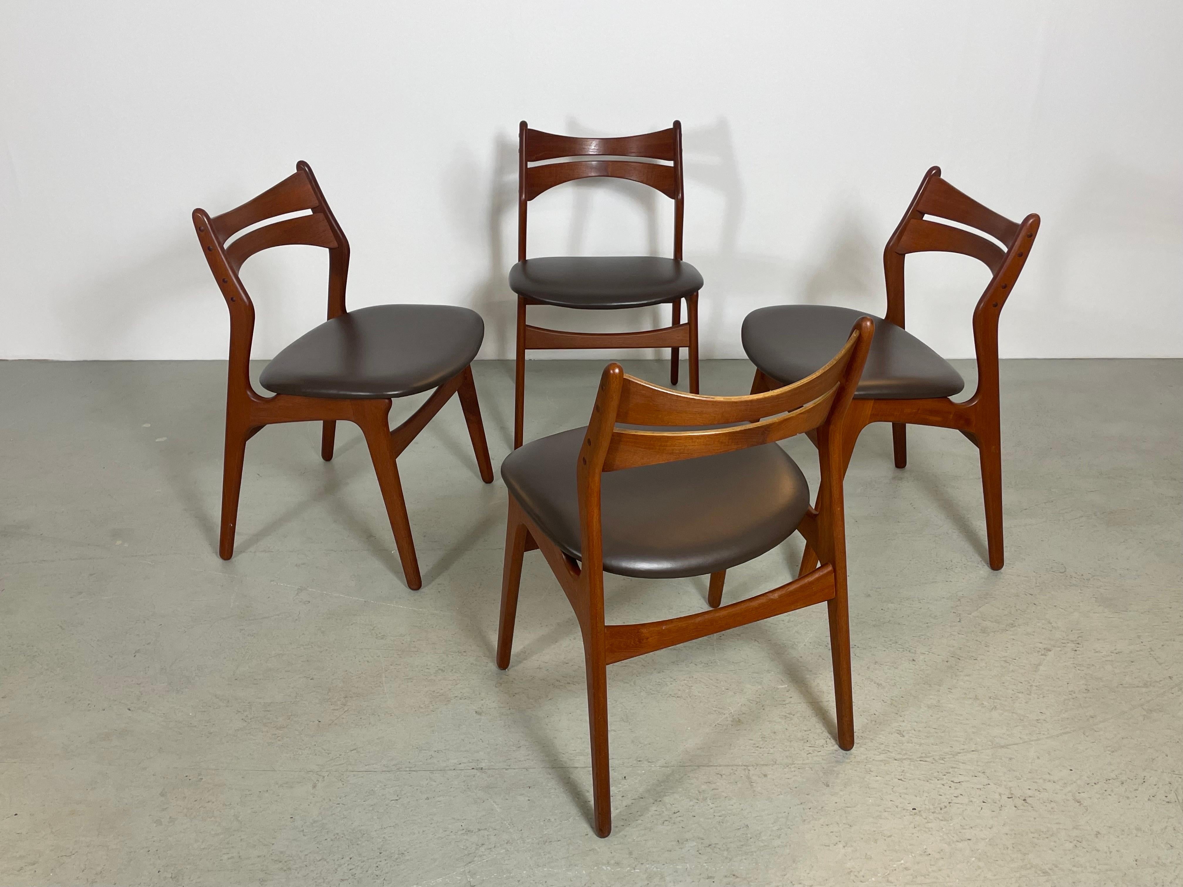 A set of four of mid-century dining chairs by Danish Designer Erik Buch. Made in Denmark during the 1950s by O.D. Mobler. This is a true design classic which features a sturdy wooden frame with organic shaped elements to create high comfort. The