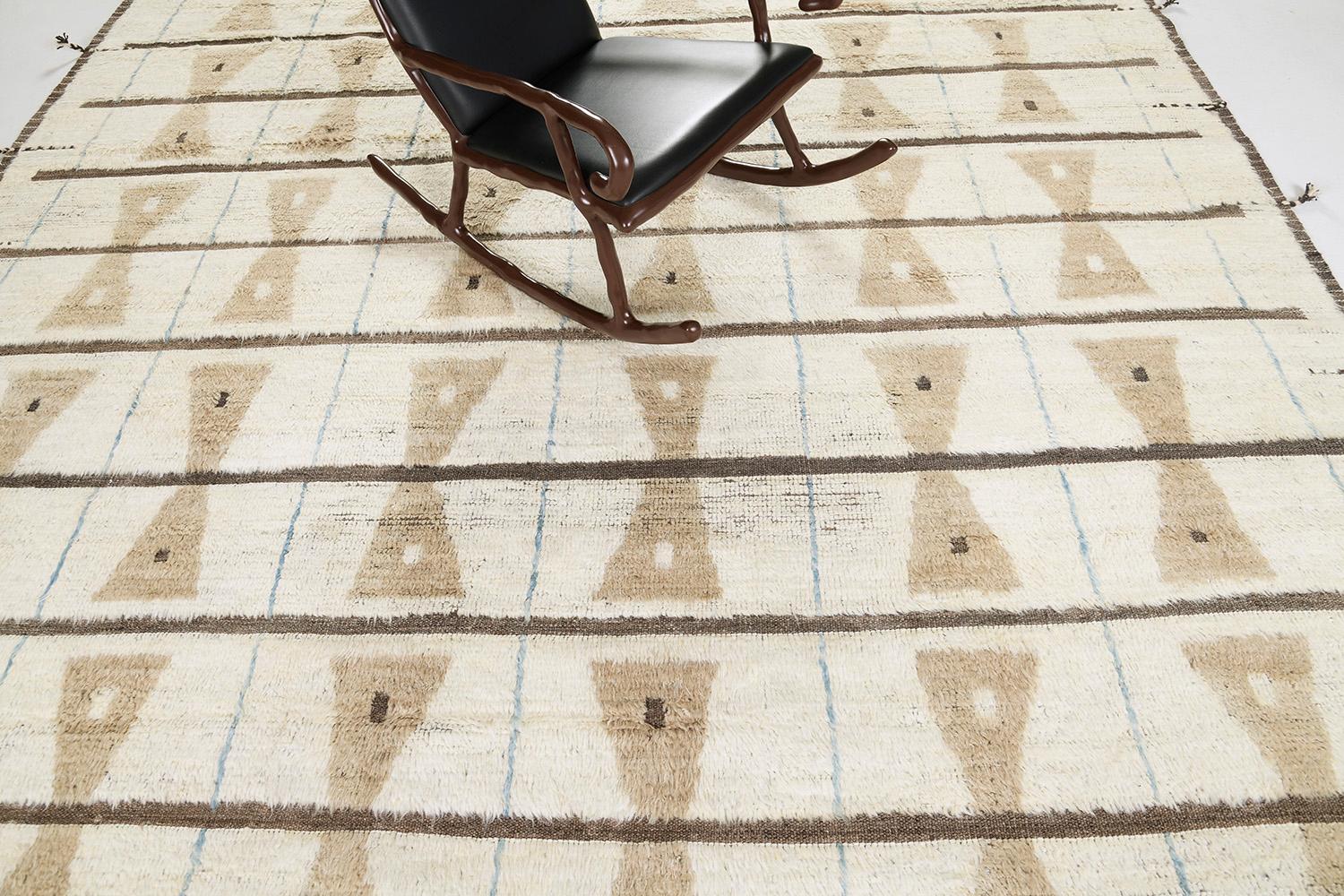 The 'Skane' rug is a handwoven wool piece inspired by vintage Scandinavian design elements and recreated for the modern design world. The repetitive grid creates balance and harmony, woven with a two-toned neutral color palette of gold and brown.