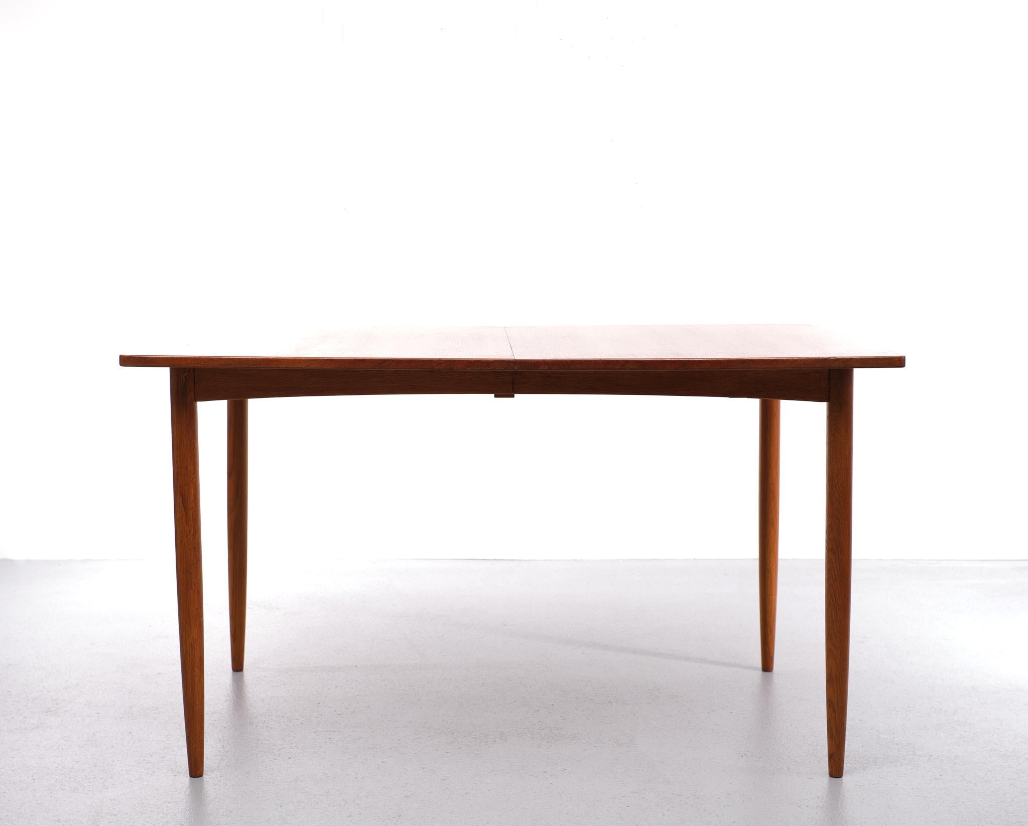 Very nice extendable dining table. Manufactured by Skaraborg Sweden 1960s.
Two extra leafs to extend are when not used stored below the top. Legs can 
Be removed. 
 Measures: height 72 cm width 130 cm / 200 cm depth 85 cm.
