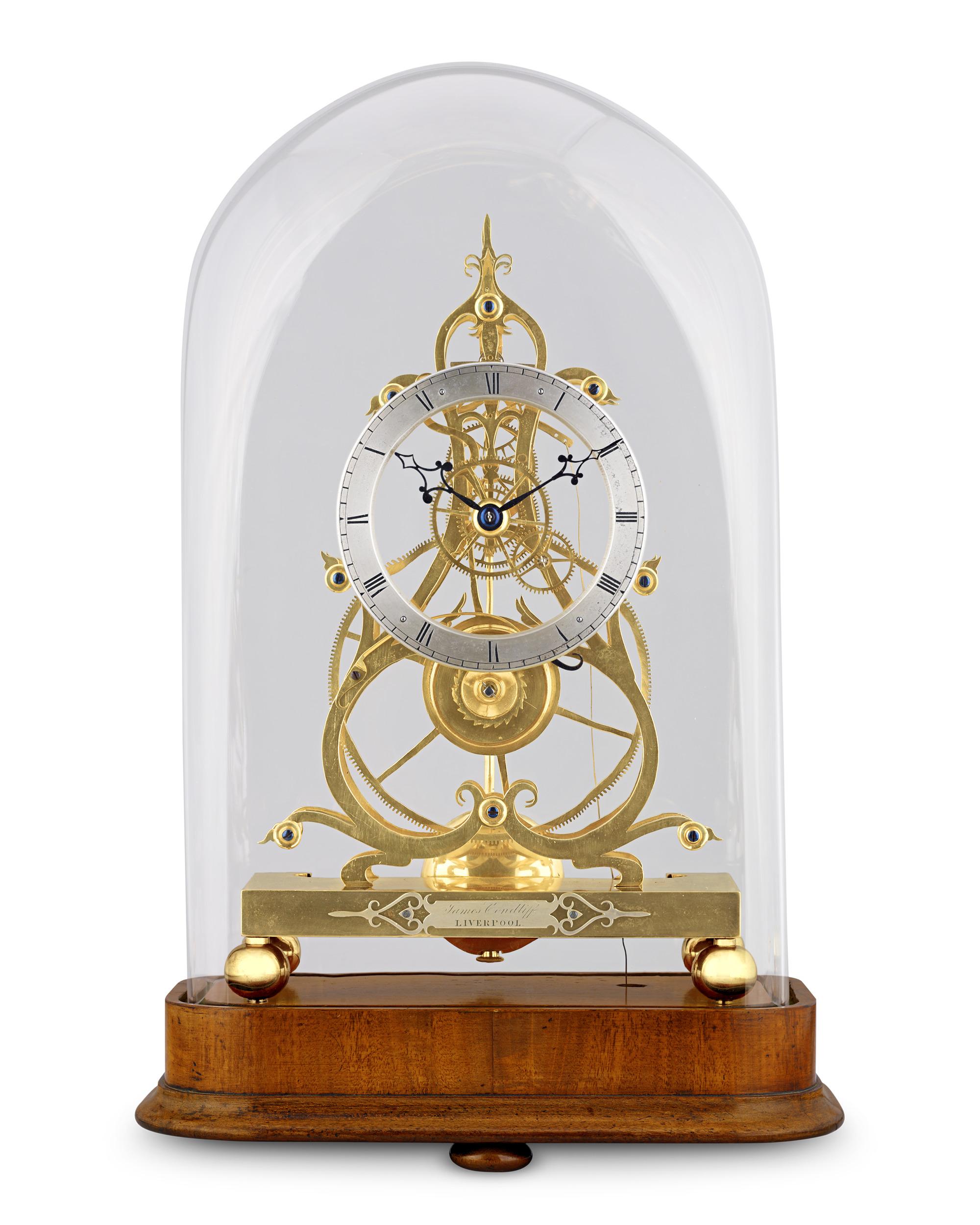 This exceptional timepiece is a Victorian-era skeleton clock crafted by James Condliff of Liverpool, a luminary in the realm of 19th-century British horology. Condliff was distinguished for his pioneering role in the development of English skeleton