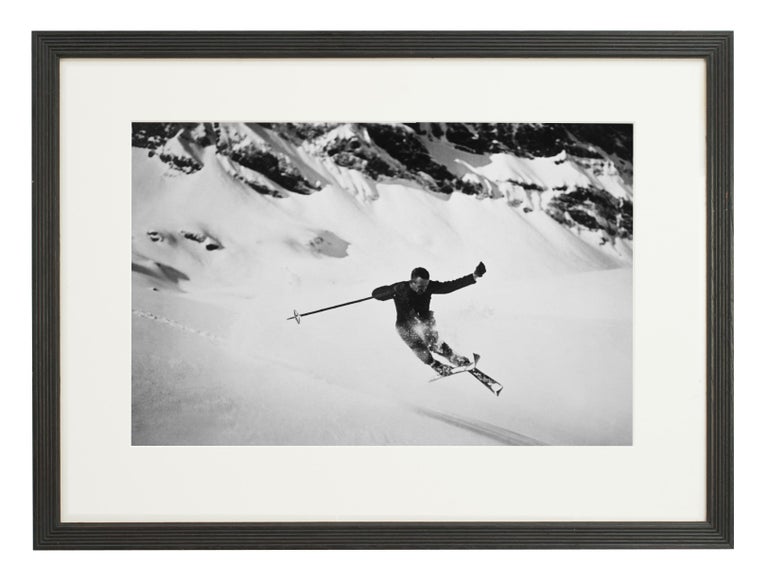 Vintage Alpine ski photograph.
Quersprung, a new mounted black and white photographic image after an original 1930s skiing photograph. Black and white alpine photos are the perfect addition to any home or ski lodge. Prior to being a recreational
