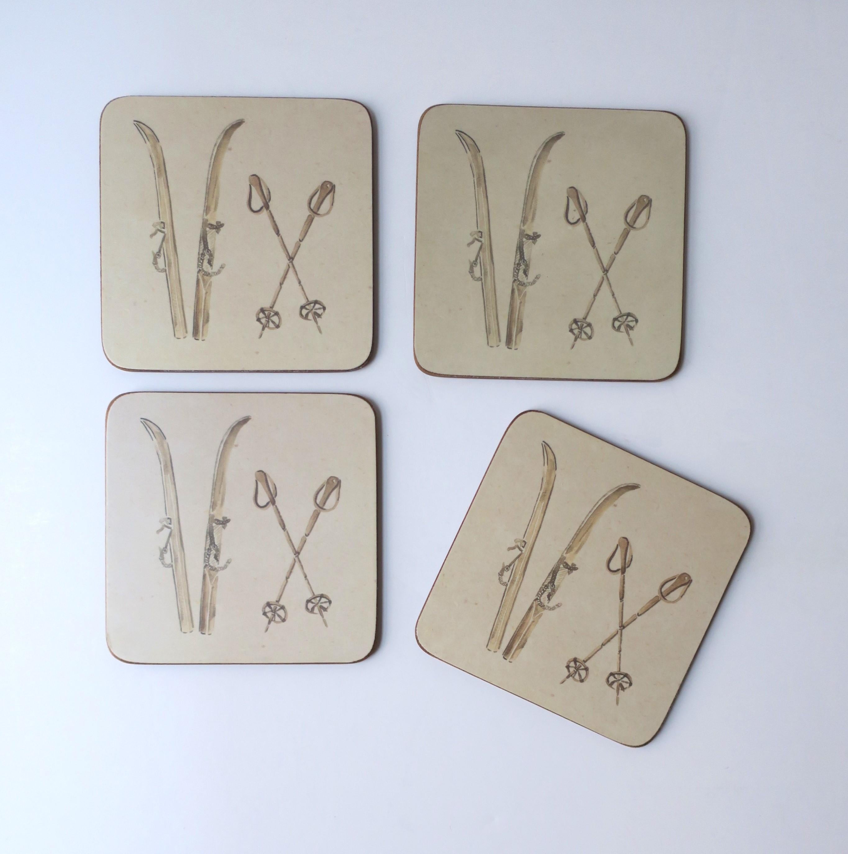 A set of four (4) alpine skier cocktail drinks coasters with cork bottom. Set depicts a rich cream neutral hue of stenciled antique skies and poles. A great set with soft round corners and protective cork bottoms. Perfect for a ski or mountain home,