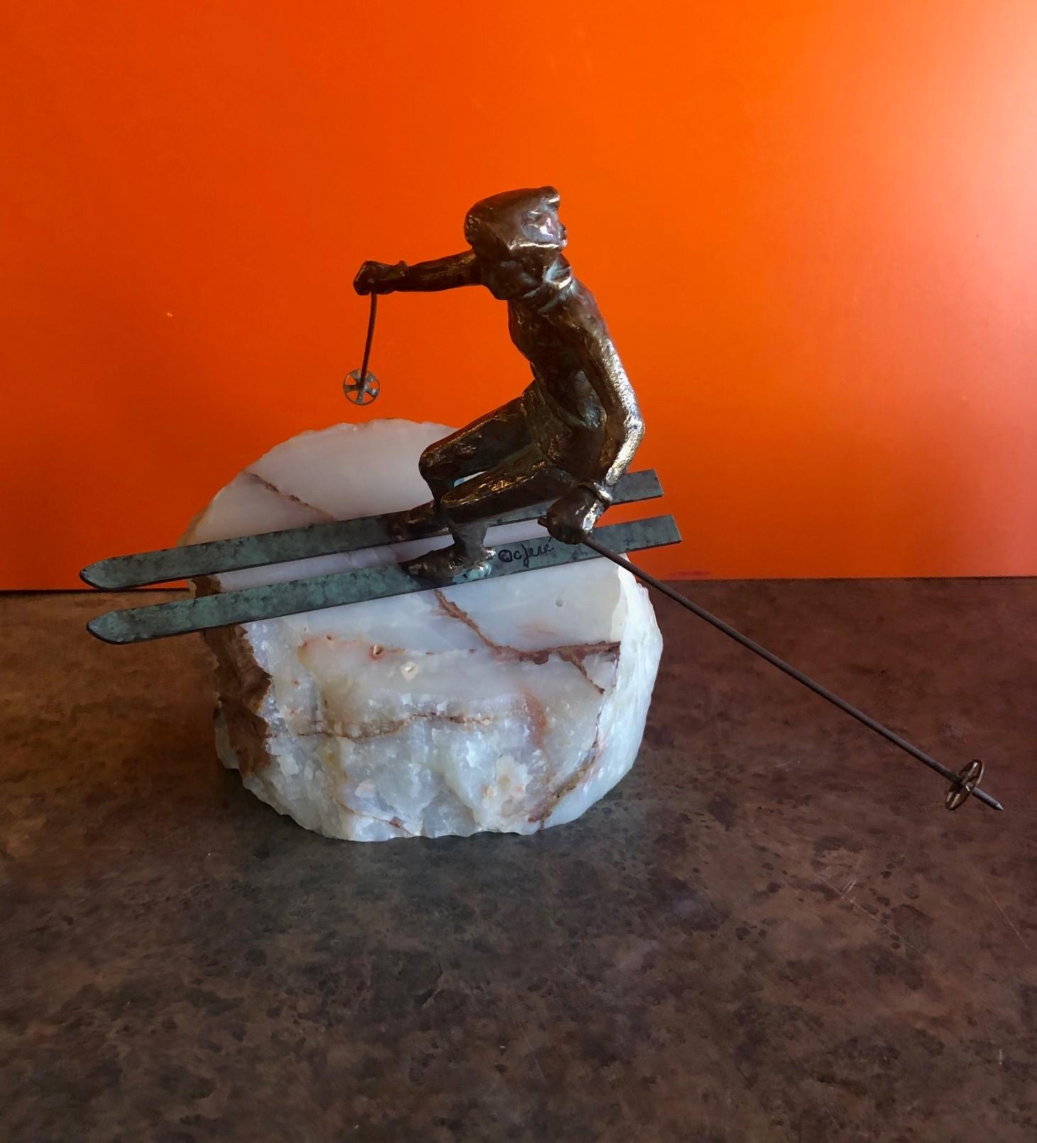 20th Century Skier Sculpture on Onyx Base by C. Jere