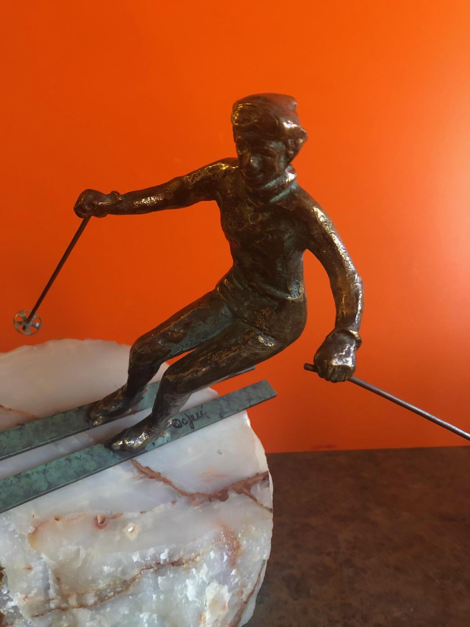 Bronze Skier Sculpture on Onyx Base by C. Jere