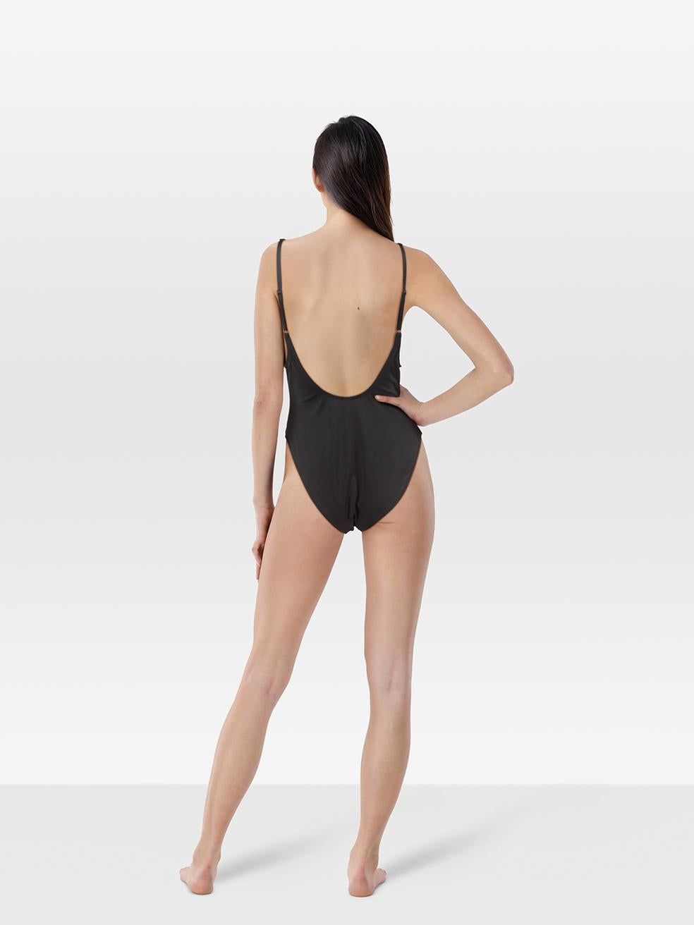 CONDITION is Never worn, with tags. No visible wear to the swimsuit is evident on this new Skims designer resale item.
 
 Details
 
 
 Black
 
 Synthetic
 
 Swimsuit
 
 Adjustable straps
 
 Round neck
 
 Scoop neck back
 
 Stretchy
 
 
 
 Made in
