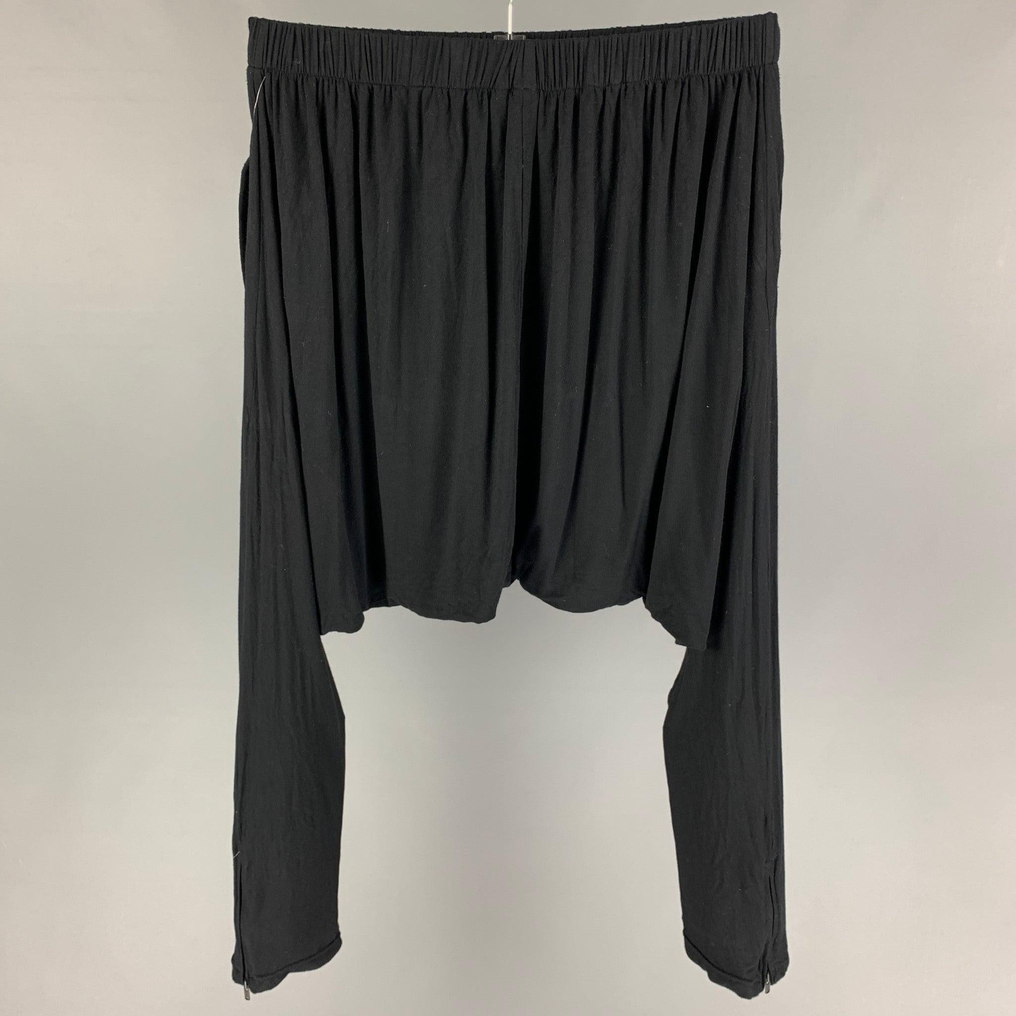 SKINGRAFT pants comes in a black rayon / silk featuring a drop-crotch style, zipped cuffs, and a elastic waist.
Good
Pre-Owned Condition. 

Marked:   M  

Measurements: 
  Waist: 28 inches  Rise: 20 inches  Inseam: 36 inches 
  
  
 
Reference: