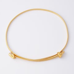 Skinny Gold Stretch Belt with Ram's Head Buckles, 1980s