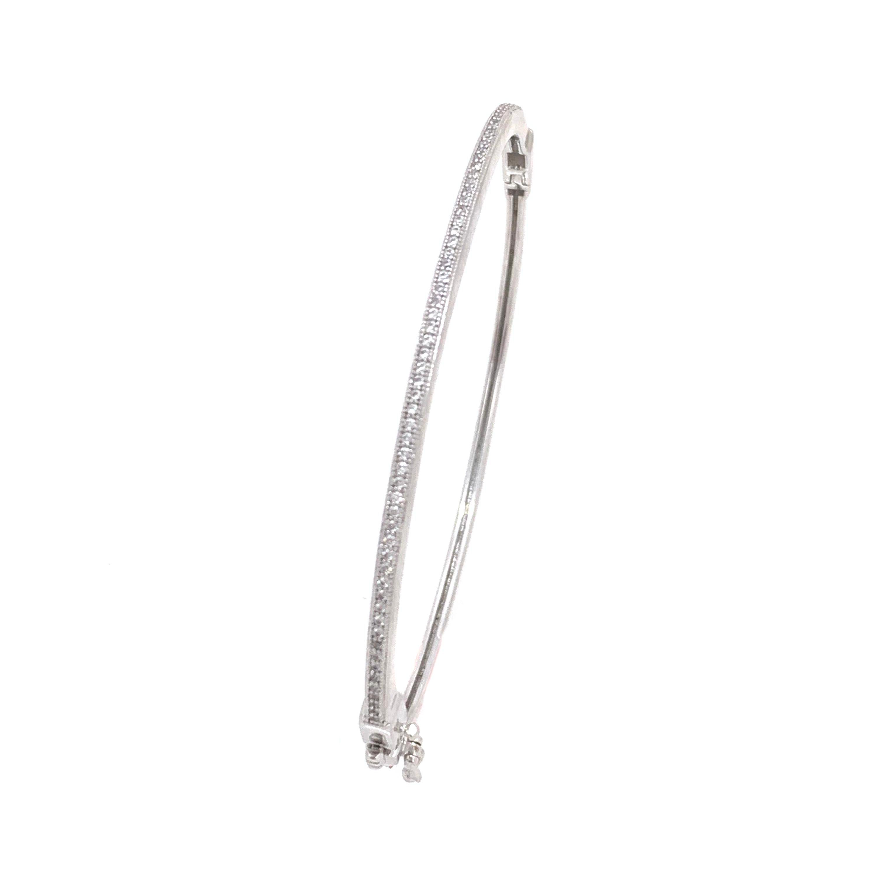 Skinny Micropave Simulated Diamond Sterling Silver Bangle Bracelet.

This chic and modern skinny bracelet features over 72 pcs of round simulated diamond, micro set on platinum rhodium plated sterling silver, push clasp closure and ‘8’ safety lock.