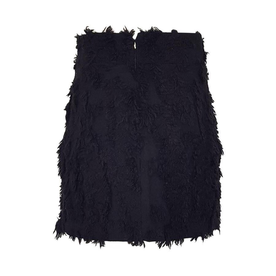 Mixed wool Black color Relief effect Back zip closure Total length cm 46 (18.1 inches) Waist cm 36 (14.2 inches)
