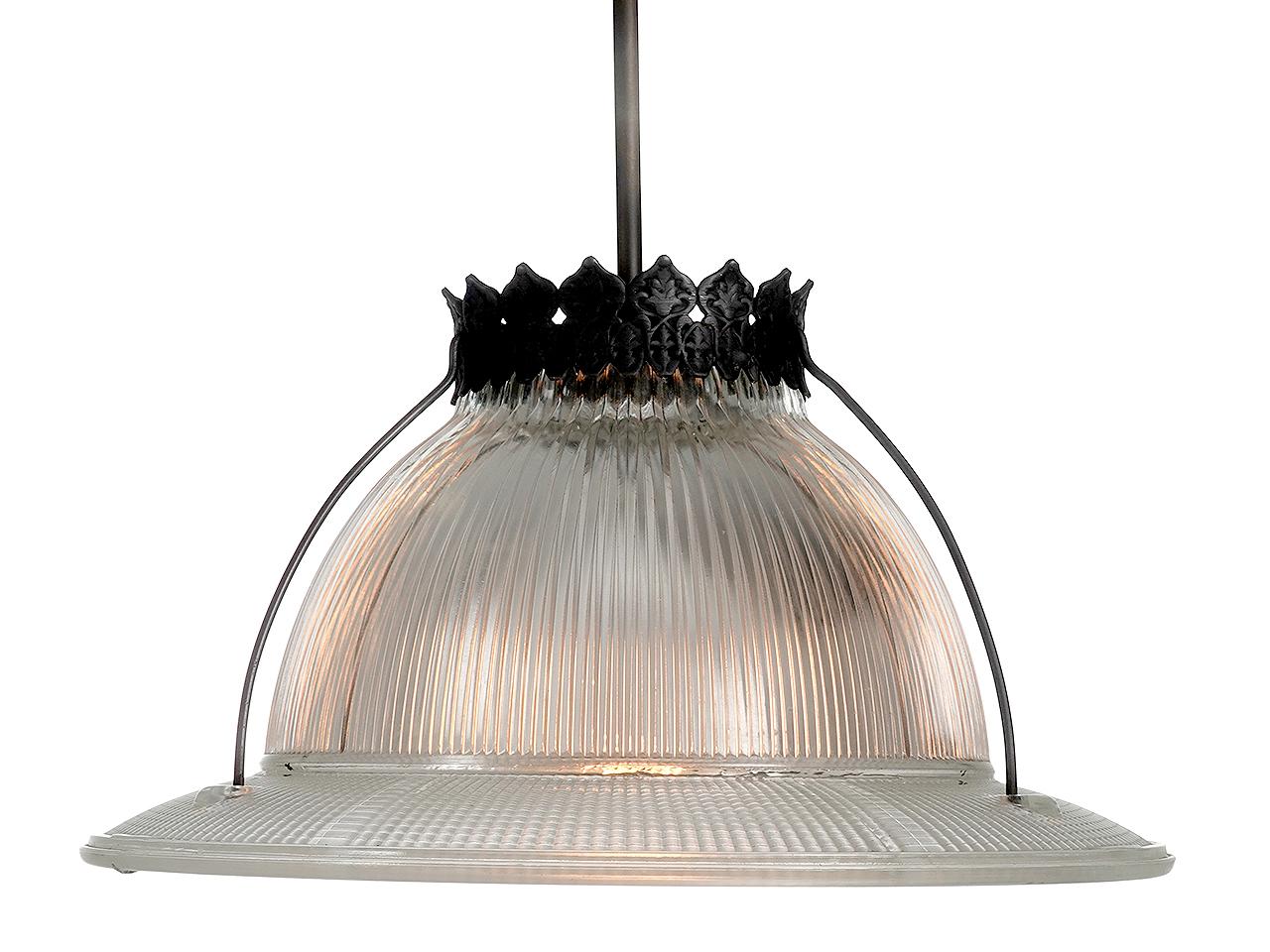 I think this is the best looking prismatic lamp we have ever offered. It has a 15.5 inch diameter decorative crown and hangs from 3 contoured outrigger rods. We love Holophane lamps because of the wonderful light they project. The glass is all