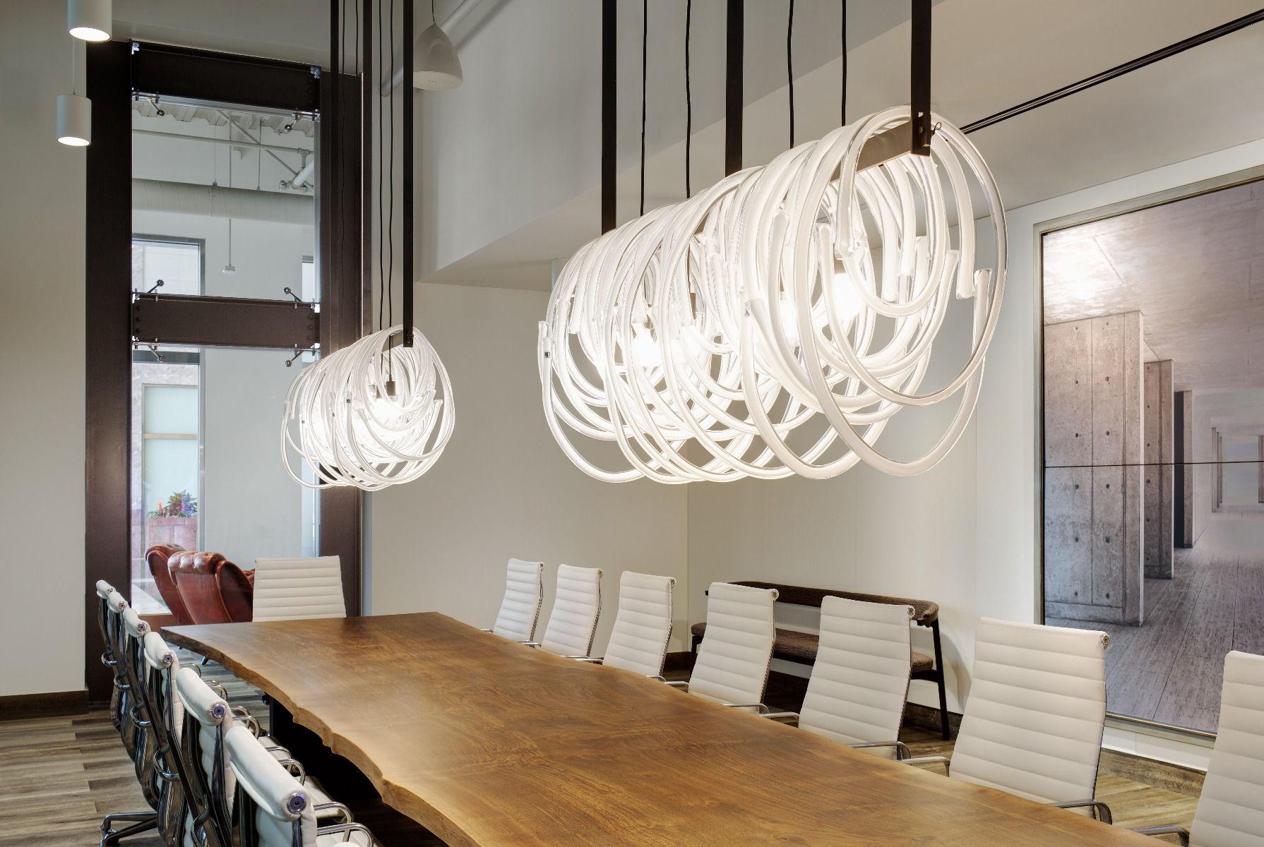 Large, linear light fixture featuring a long row of glass loops supported on a steel armature. The glass loops come in different sizes, showcasing the amazing quality and clarity of the Czech handblown glass. Each loop is made by hand, so each is