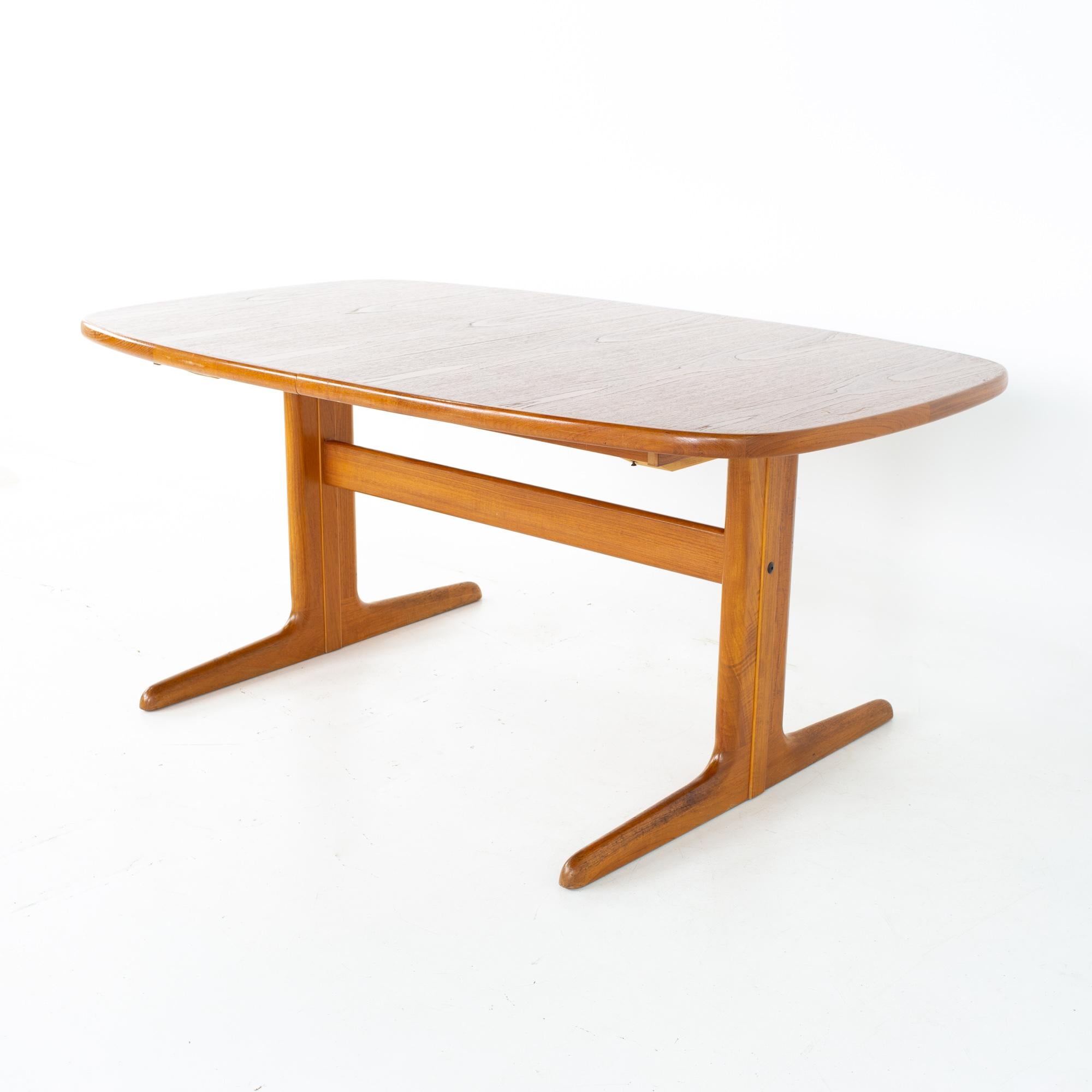Skovby Møbelfabrik mid century teak oval expanding 10 person dining table.
Table measures: 65 wide x 39.5 deep x 28 inches high 

All pieces of furniture can be had in what we call restored vintage condition. That means the piece is restored upon