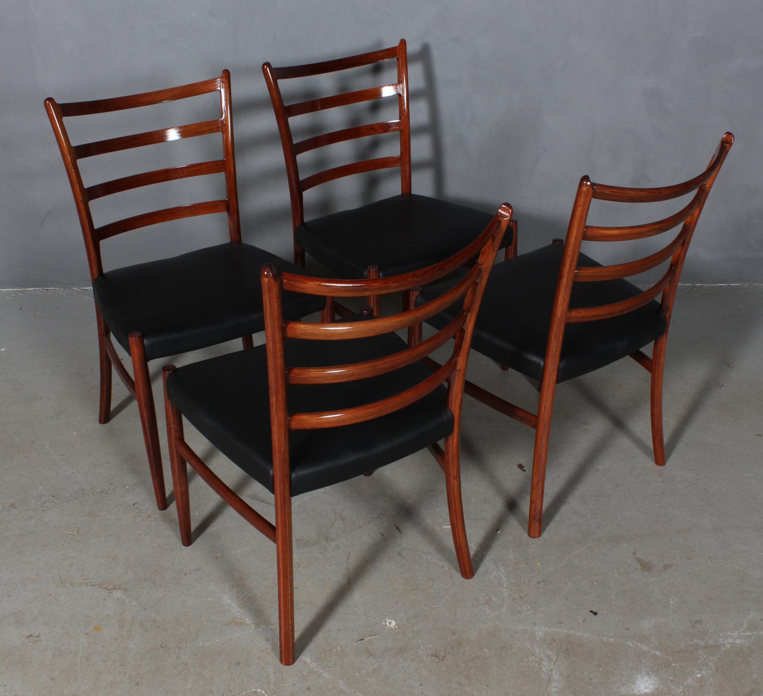 Skovby Møbelfabrik set of four dining chairs in partly solid rosewood.

New upholstered with black aniline leather.

Made in the 1960s.