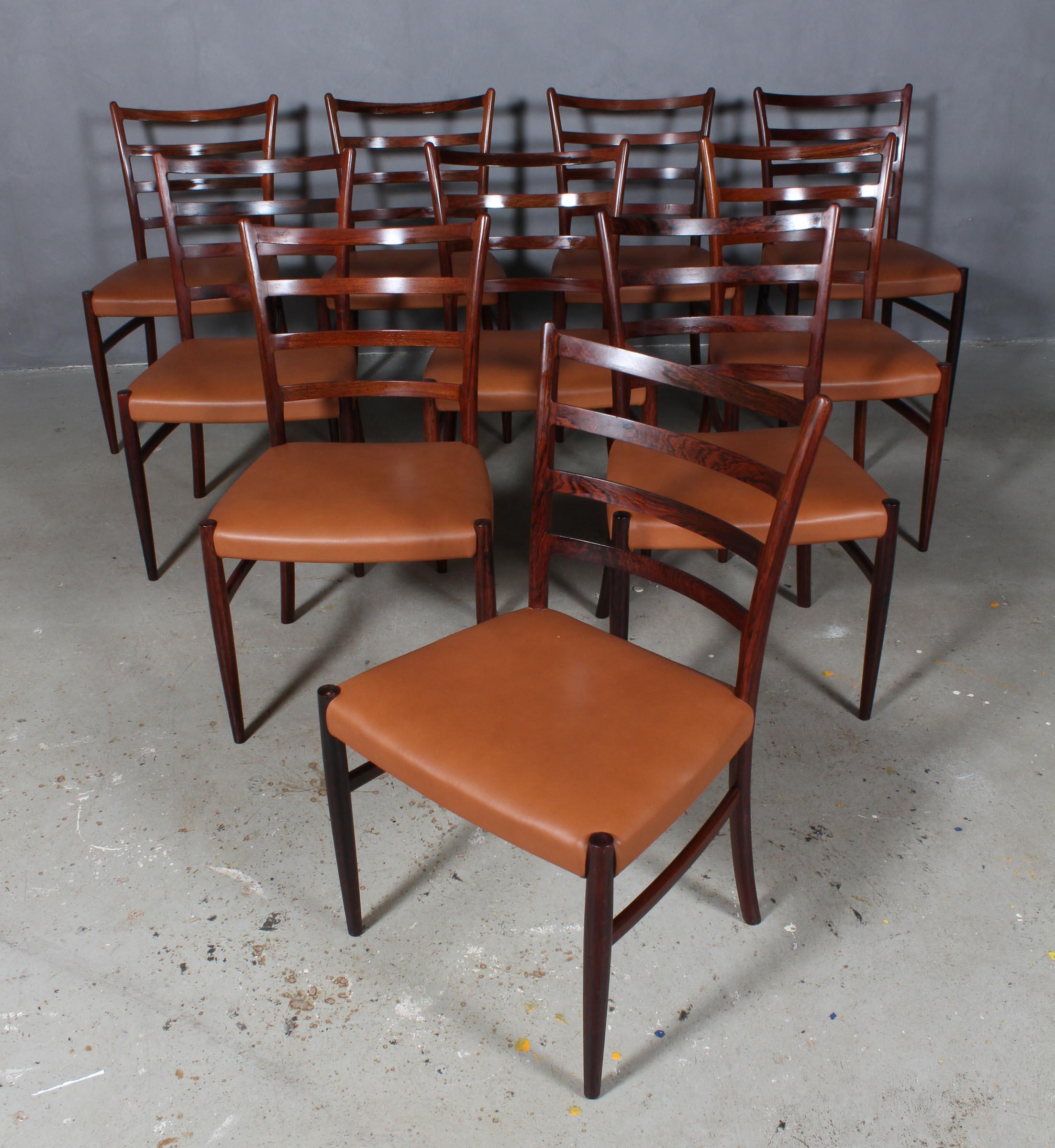 Skovby Møbelfabrik ensemble de quatre chaises de salle à manger en bois de rose partiellement massif.

Nouveau rembourrage en cuir aniline cognac.

Fabriqué dans les années 1960.