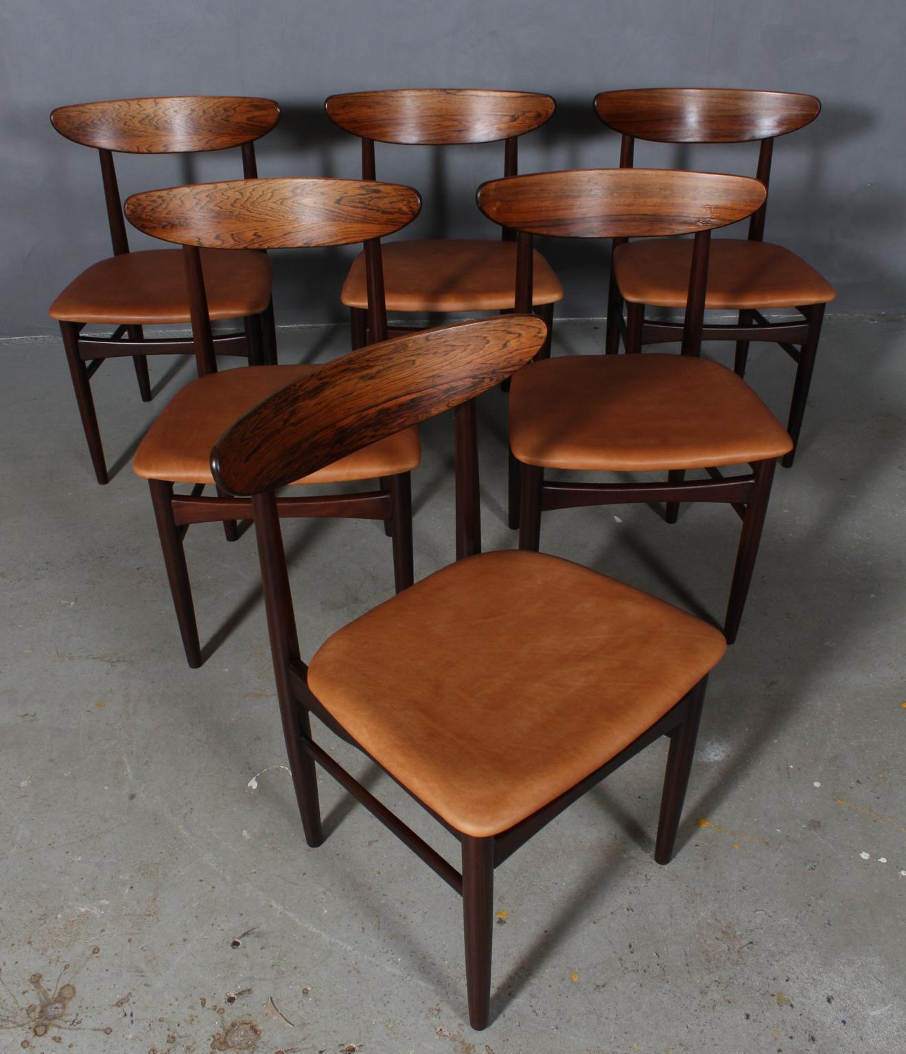 Skovby Møbler. Set of six chairs in rosewood.

New upholstered seats with tan vintage aniline leather.

Made by Skovby Møbler.