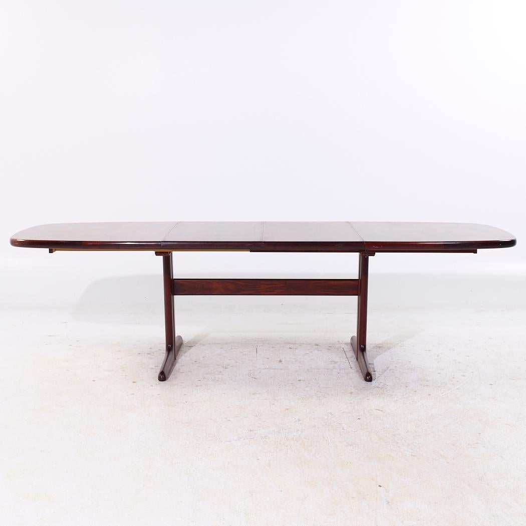 Skovby Mid Century Danish Rosewood Hidden Leaf Expanding Dining Table with 2 Leaves

This table measures: 65 wide x 39.5 deep x 28.25 inches high, with a chair clearance of 26.5 inches, each leaf measures 19.75 inches wide, making a maximum table