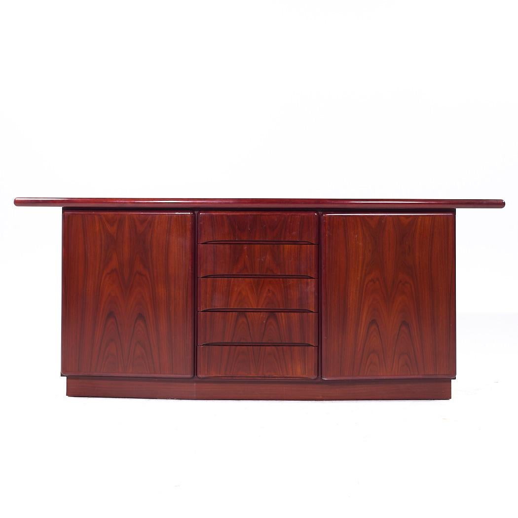Skovby Mid Century Danish Rosewood Credenza

This credenza measures: 78.75 wide x 19.25 deep x 32 inches high

All pieces of furniture can be had in what we call restored vintage condition. That means the piece is restored upon purchase so it’s free