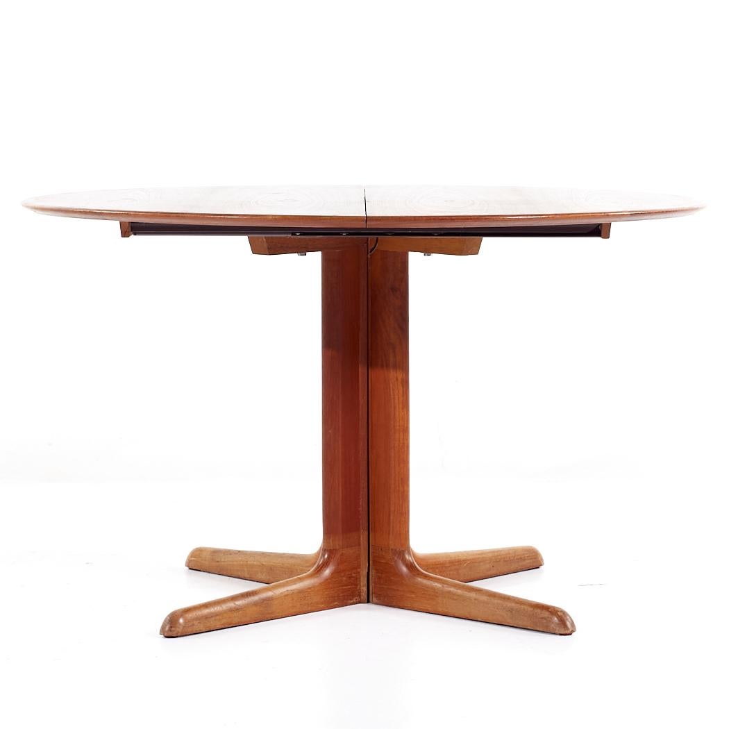Skovby Mid Century Danish Teak Expanding Dining Table with 2 Leaves

This table measures: 47.25 wide x 47.25 deep x 28 inches high, with a chair clearance of 27 inches, each leaf measures 19.75 inches wide, making a maximum table width of 86.75