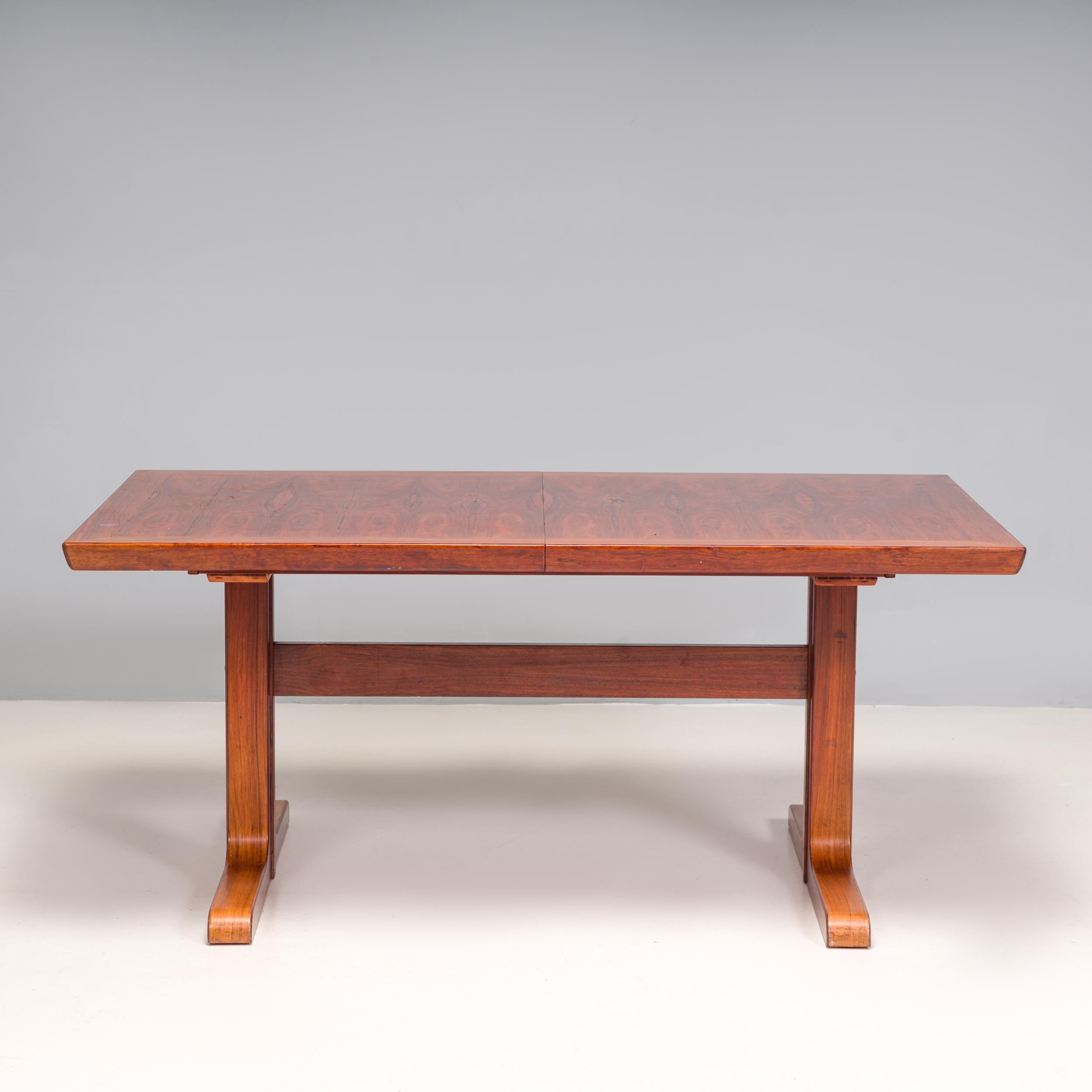 A fantastic example of Danish mid-century modern design, this extending dining table was made by renowned cabinet manufacturer Skovby Møbelfabrik between the 1960s and 1970s. 

Constructed from rosewood, the dining table has a large rectangular