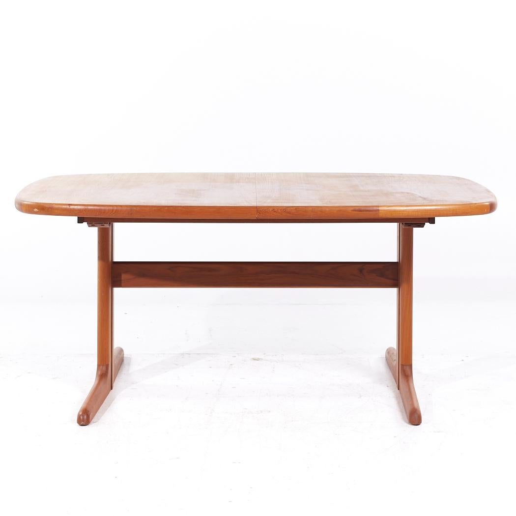 Skovby Mid Century Teak Hidden Leaf Dining Table with 2 Leaves

This table measures: 65 wide x 39.5 deep x 28 inches high, with a chair clearance of 26.5 inches, each hidden leaf measures 19.75 inches wide, making a maximum table width of 104.5