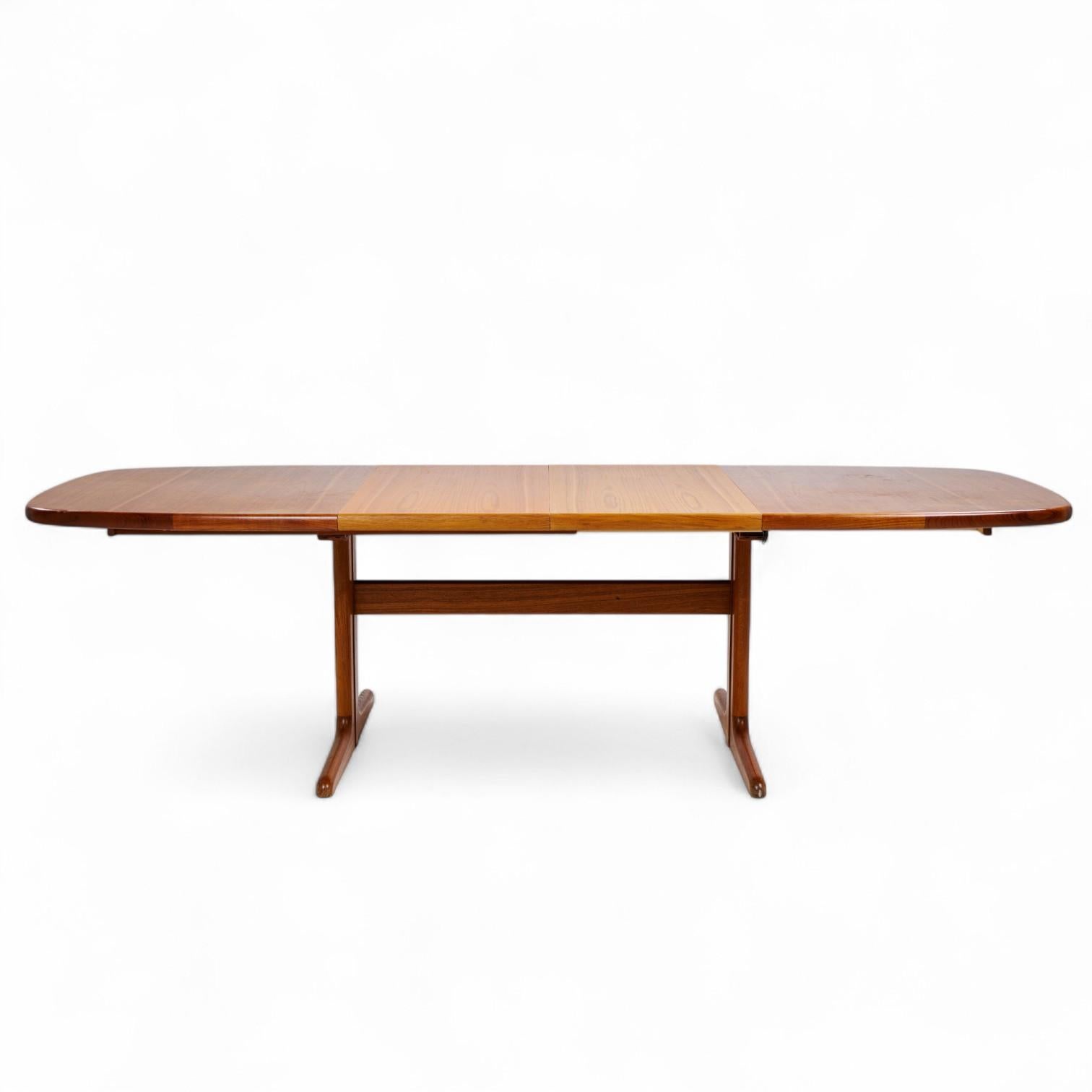 Skovby Mid Century Teak Hidden Leaf Dining Table with 2 Leaves

This table measures: 65 wide x 39.5 deep x 28.5 inches high, with a chair clearance of 26.75 inches, each leaf measures 19.5 inches wide, making a maximum table width of 104 inches when