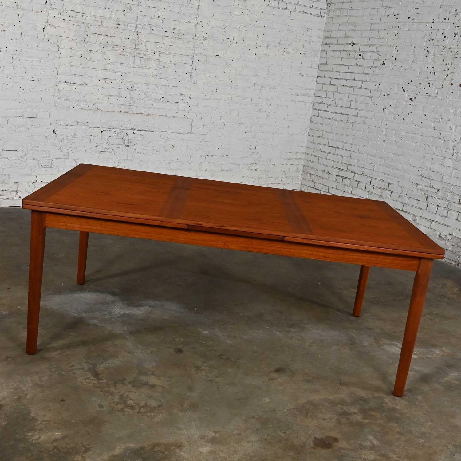 Stunning vintage Skovby Mobelfabrik A/S Scandinavian Modern teak draw leaf extending dining table. Beautiful condition, keeping in mind that this is vintage and not new so will have signs of use and wear. The table has been totally refinished and