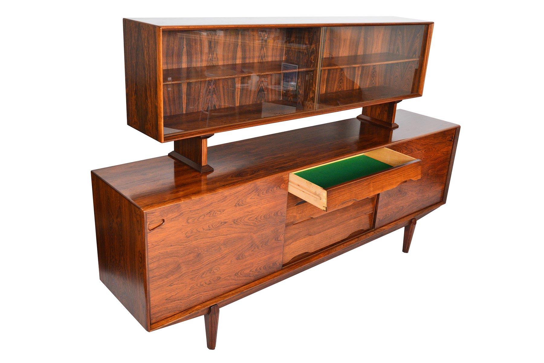 This beautiful Danish modern Brazilian rosewood credenza model 65 was manufactured by Skovby in the 1960s. Finished on all sides in rosewood, this piece would make an excellent room divider! The original hutch rests atop the credenza with