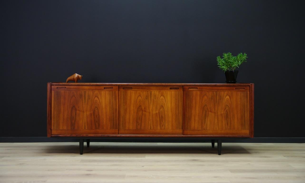 Classic 1960s-1970s sideboard, Danish design. Surface veneered with rosewood. Manufactured in the Skovby Møbelfabrik. Item has a roomy interior with shelves and two drawers behind the sliding doors. Preserved in good condition (small dings and