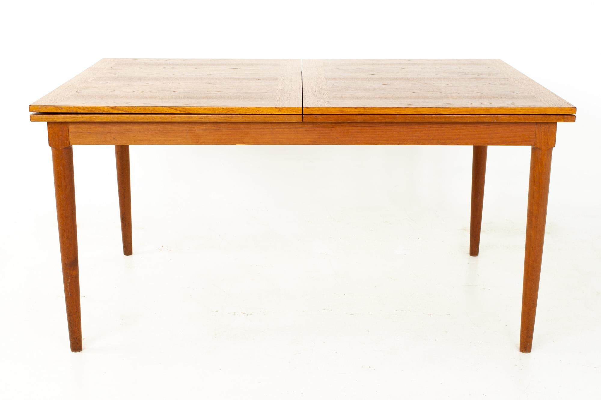 Skovmand and Andersen mid century teak hidden leaf dining table

Table measures: 57 wide x 37.5 deep x 29 inches high

?All pieces of furniture can be had in what we call restored vintage condition. That means the piece is restored upon purchase