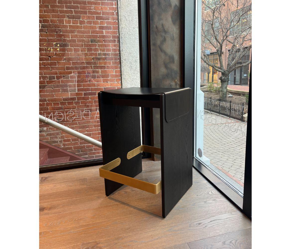 Designed by A. Jacob Marks

The Piedmont #1 Stool is a backless stool with solid timber construction and a reinforced heavyweight leather sling seat. Includes a metal footrest for added durability.