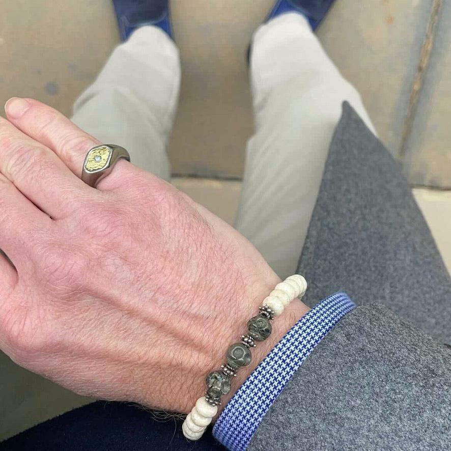 Story Behind the Jewelry
﻿This masculine bracelet is comprised of white turquoise and carved pyrite skulls. Skulls represent power and immortality.  In the Roman Empire, warriors decorated their armor with skull accessories. They believed that the