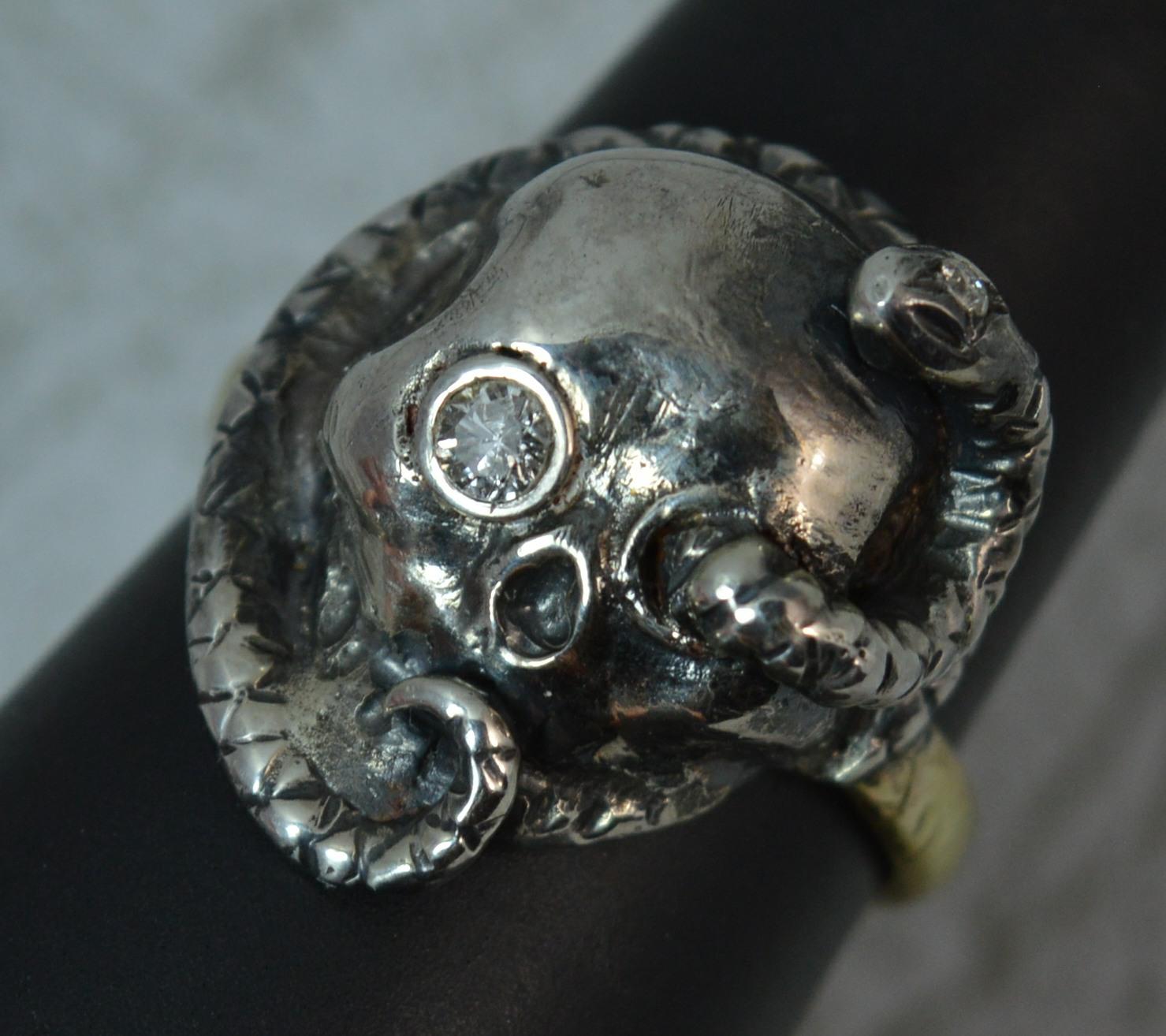 An awesome gothic Skull and Snake design unisex ring.
SIZE ; Q 1/2 UK, 7 1/2 US
Modelled with a vintage 9 carat gold shank with textured finish.
The head modelled in oxidized silver with a skull to centre and snake coiled around.
17mm x 20mm head.