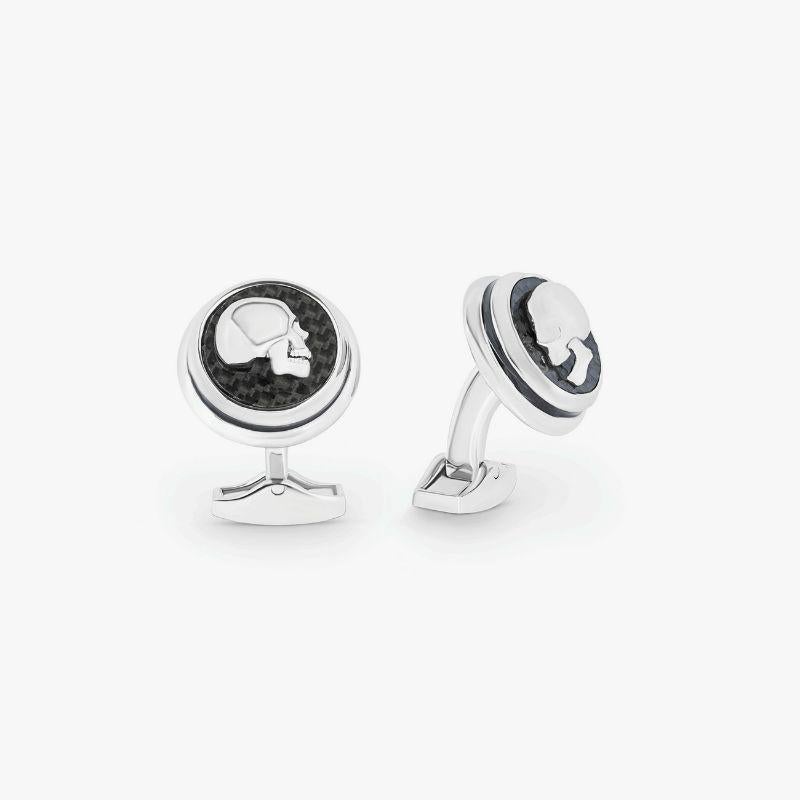 Skull cufflinks with black carbon fibre

The classic carbon fibre cufflinks have a contemporary update with half a skull on top. The mirror image pair features a moving jaw for added interest and is available in black carbon fibre set into a rhodium