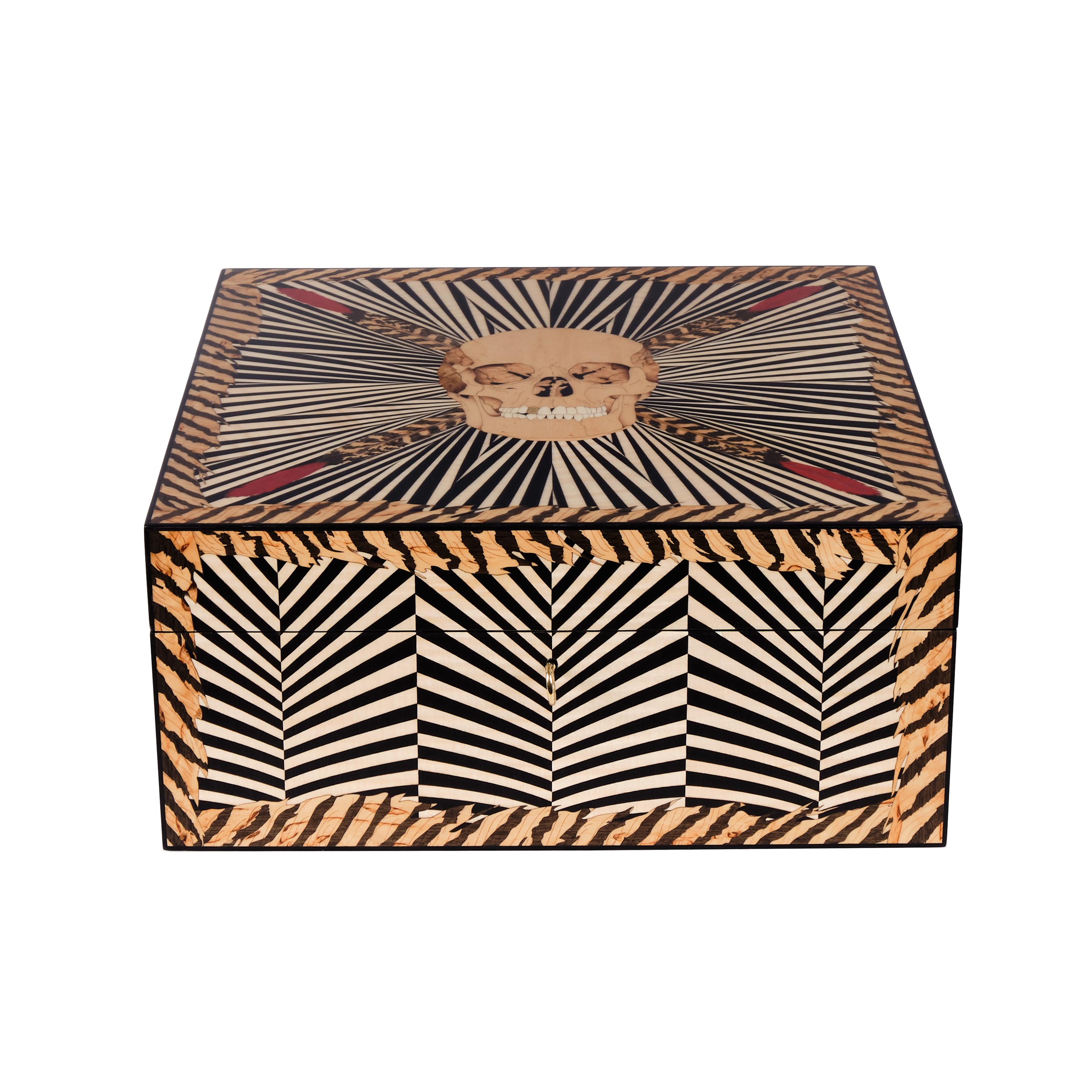 Darkly playful and meticulously crafted, Alexandra Llewellyn’s Skull Marquetry Poker Set is a bold meditation on risk, luck and the high stakes of the game. The lifelike skull—complete with a gold tooth—is inlaid with intricate wood marquetry,