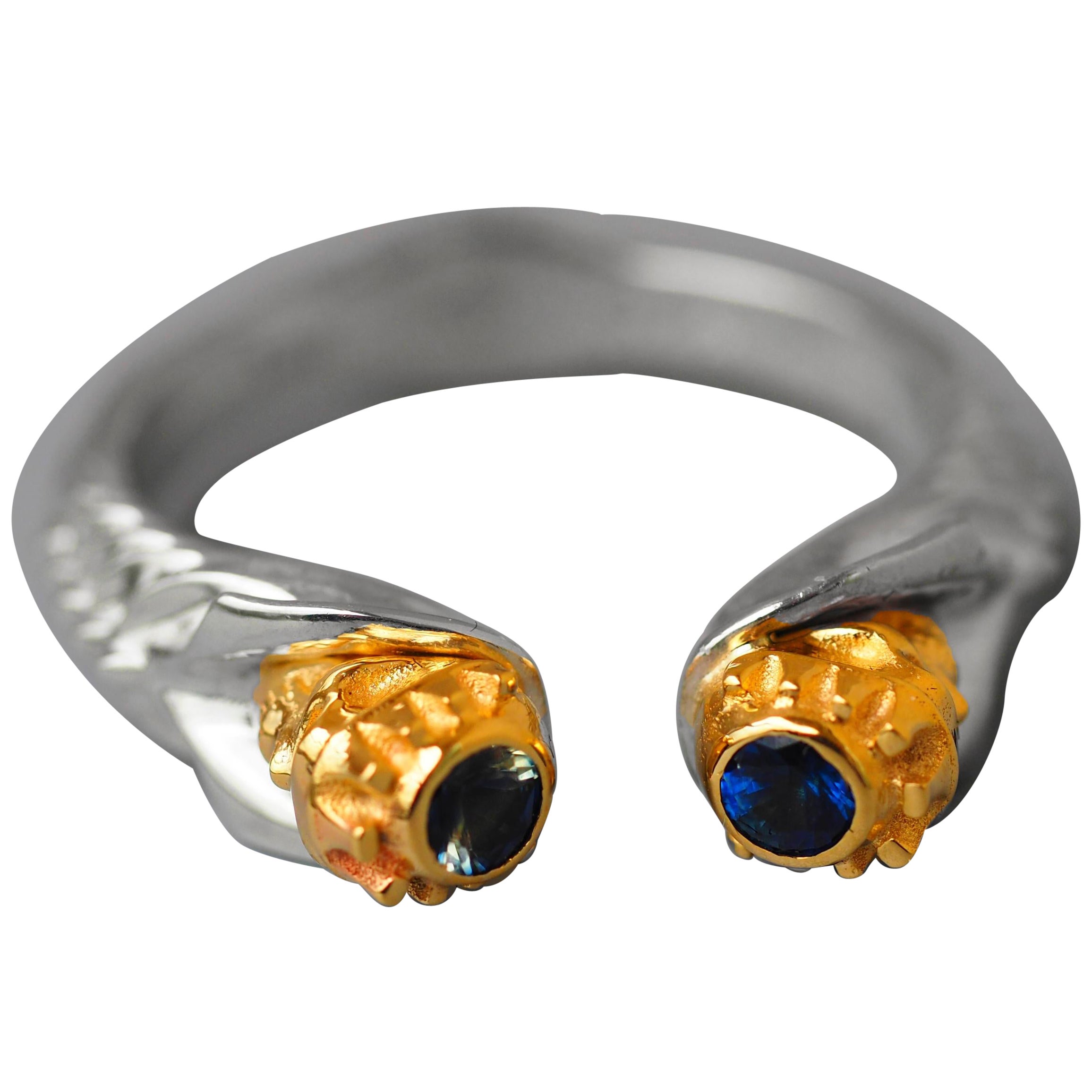 Skull ring with blue sapphires.