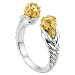 Skull ring with yellow sapphire in silver, gold