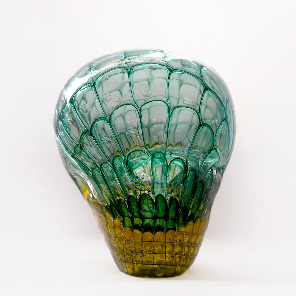 Green and yellow honeycomb object by the well-known glass artist Jörg F. Zimmermann from Uhingen.
This specific piece has a very unique shape and structure, strongly reminiscent of a skull. As Zimmermann's honeycomb pieces are always subject to