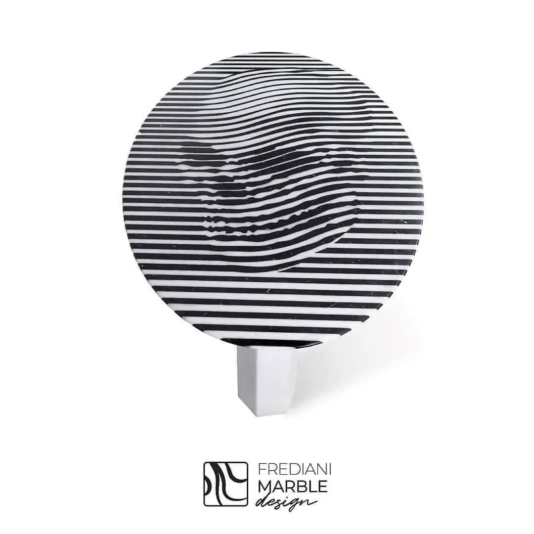 Description of the “Skull Table”:

What makes this piece unique or special?
The Skull Table is a unique creation by designer Andrea Frediani. It is a one-of-a-kind piece crafted from three premium types of marble: Black Marquina, Greek Thassos, and
