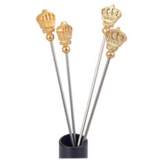 Skultuna. Cuatro palillos de cóctel con remates de corona dorados. Finales del siglo XX