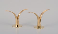 Skultuna, pair of "Liljan" (Lilly) candle holders in brass. 21st C.