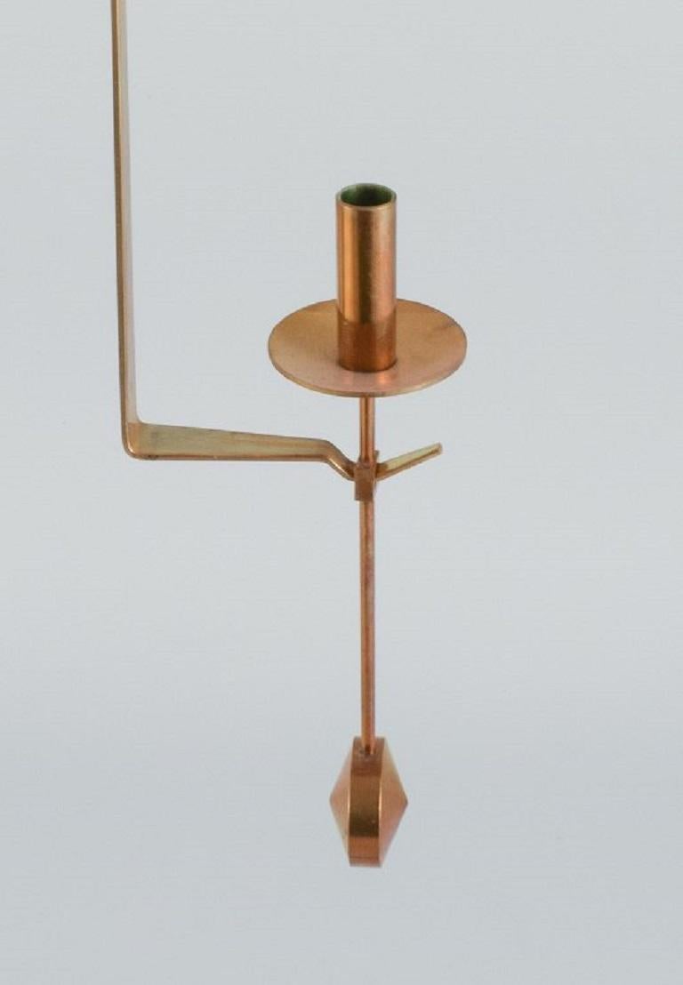 Scandinavian Modern Skultuna, Sweden. A pair of brass candlesticks for wall hanging. 