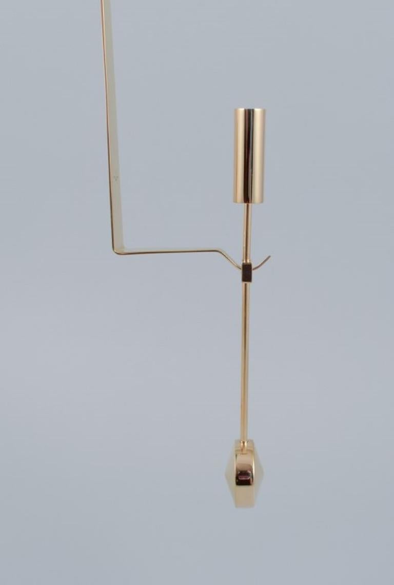 Contemporary Skultuna, Sweden. Pair of wall-mounted candle holders in brass. 21st C. For Sale