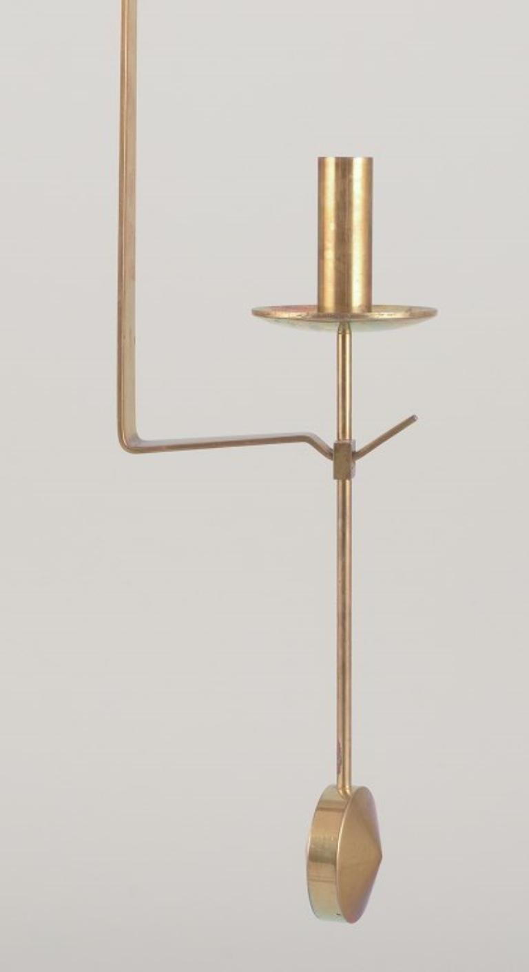Swedish Skultuna, Sweden. Pair of wall-mounted candle sconces in brass. 1970/80s For Sale