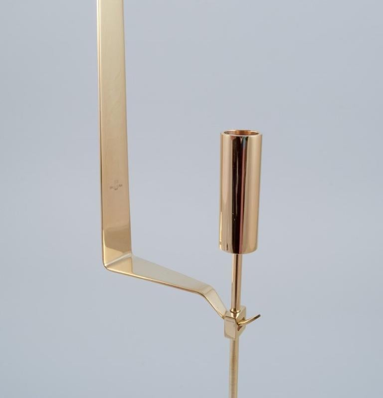 Swedish Skultuna. Two wall-mounted candle holders in brass. Designed by Pierre Forsell For Sale