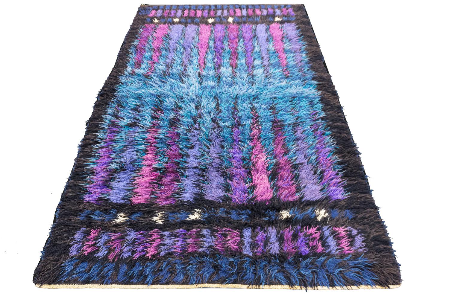 This is a vintage Swedish rug circa 1950-1970 known as a “Rya” rug which translates to simply rug and its size is 224 x 127CM. Its field makes up a back-gammon type of design with many inner field protruding spikes. It's in full pile condition and