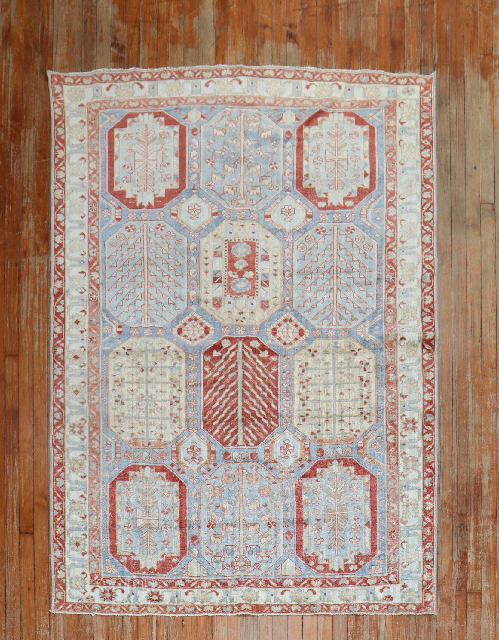 A large scale sky blue ground Persian Bakhtiari square intermediate size rug from the 1940s

Measures: 4'11